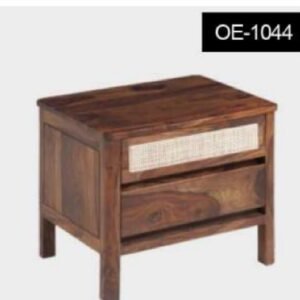 Wooden bedside table with two drawers and a woven front panel on the top drawer.